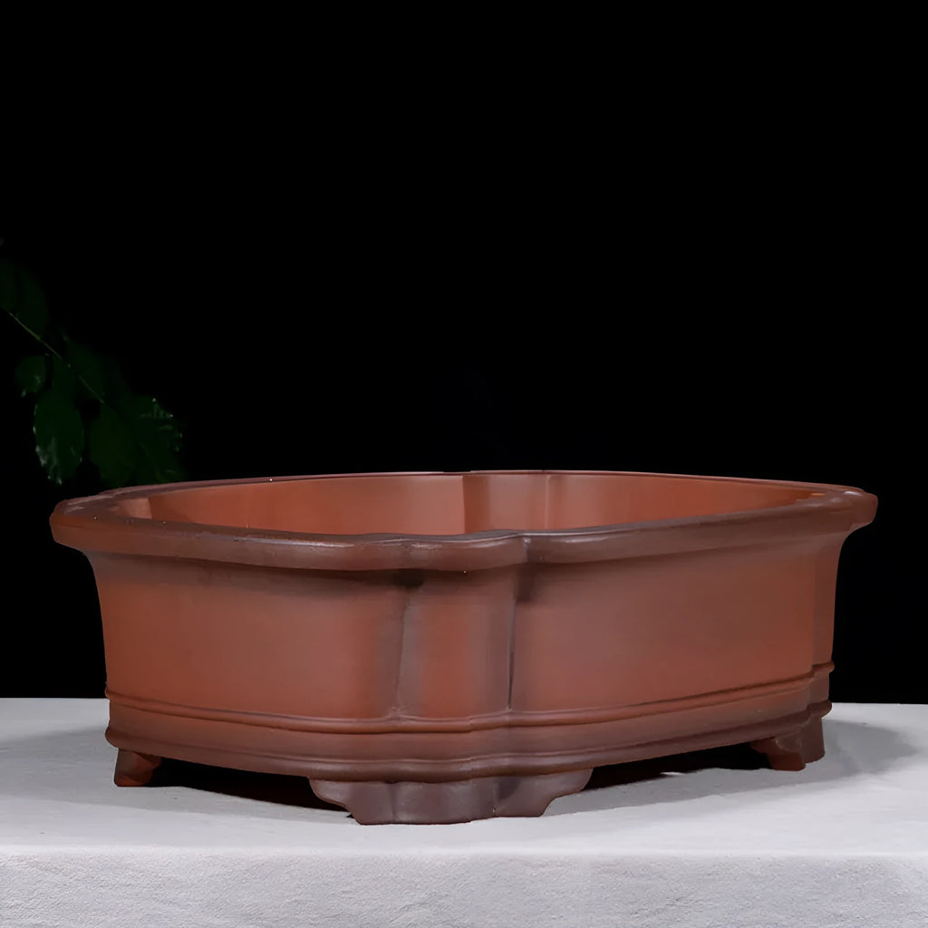 Large antique-look purple clay flowerpot with Chinese tree stump and floral patterns.