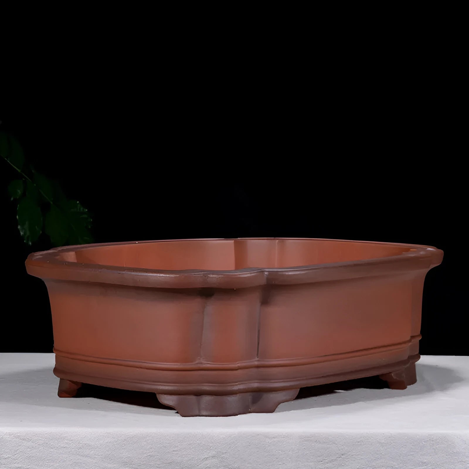 Large antique-look purple clay flowerpot with Chinese tree stump and floral patterns.