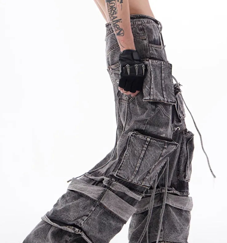 Women's grey distressed denim overalls with mop pant silhouette and rope stitching details