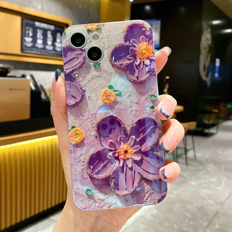 Soft rubber mobile phone case with purple oil painting flower design and inlaid diamond accents.