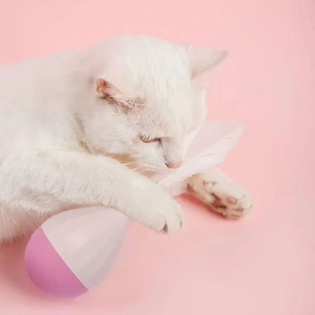 Green and pink feather tumbler cat toy with self-healing design