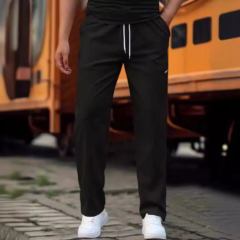 Men's polyester trousers for spring and autumn in light grey colour, showing casual fit.