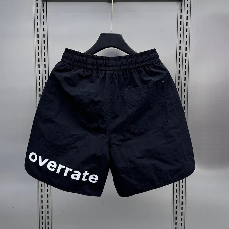 Men's lightweight polyester casual summer shorts in black or apricot with medium elastic waist, sizes M to 3XL