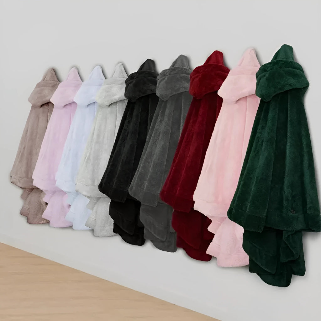 A thick pink hooded cloak bathrobe with long sleeves, shown on a hanger.