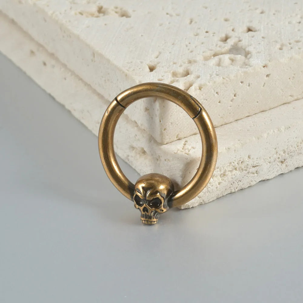 Copper ghost head punk earrings in antique silver and ancient gold finishes