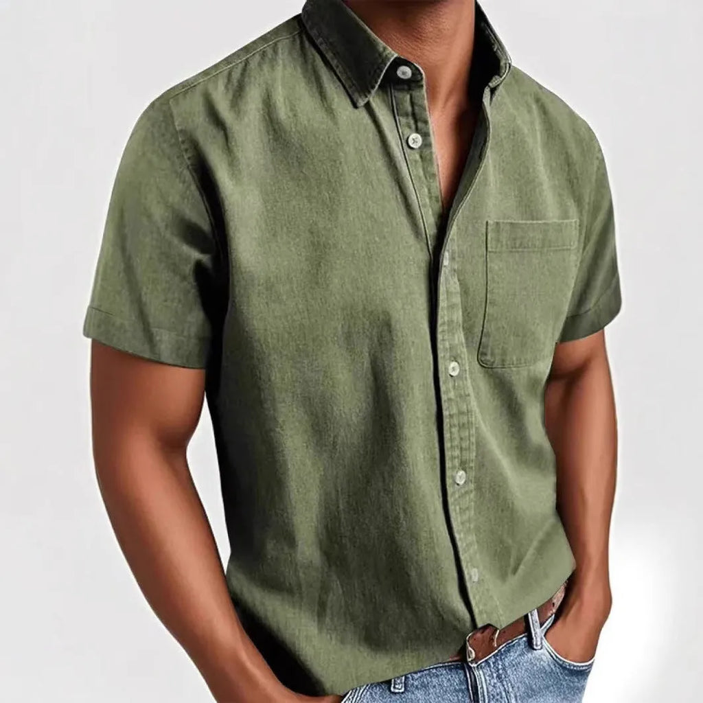 Man wearing a loose-fit grey short-sleeve cotton blend shirt with a single-breasted cardigan style.