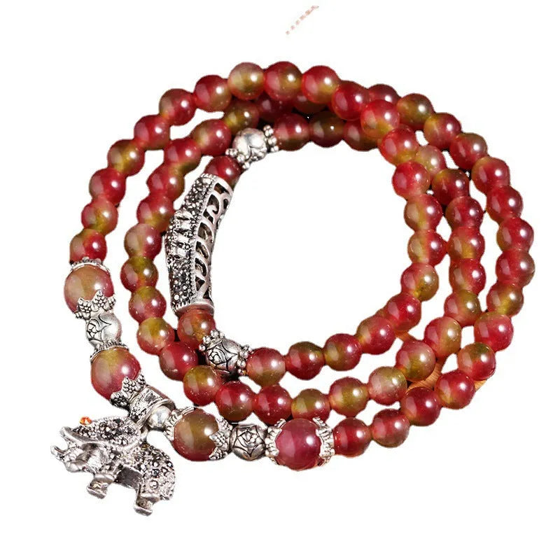 Handmade watermelon crystal bracelet with traditional Chinese knot design in geometric beads