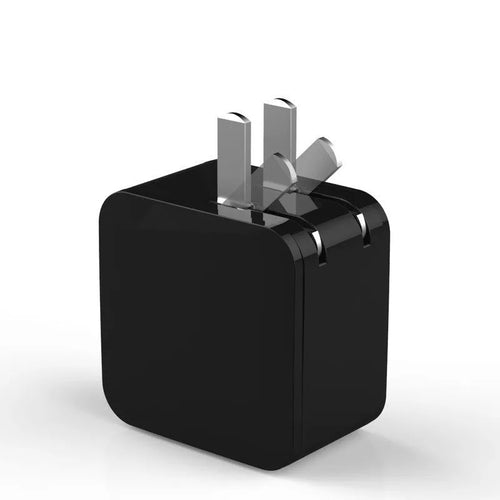 Black 5V2A travel power adapter with dual USB ports and digital display showing UK plug type