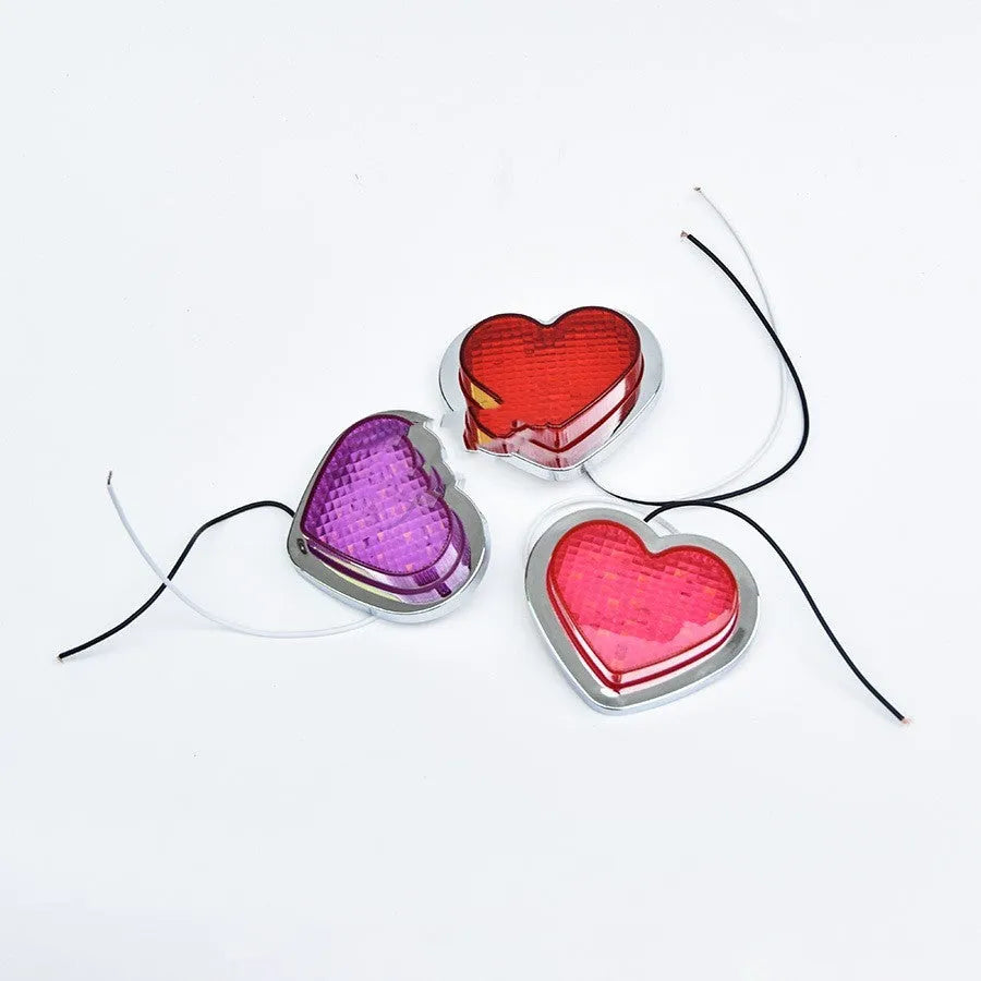 Heart-shaped red LED sidelight for car or motorcycle fender in large size.
