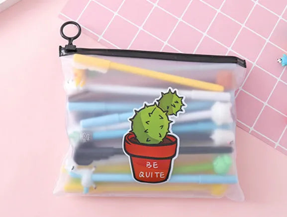 Open plastic case showing twenty 0.5mm black gel pens with cartoon cactus designs for boys and girls.