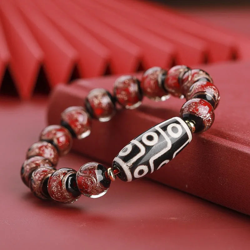 Handcrafted coloured glaze bracelet with Chinese auspicious patterns and snake beads in 10mm, 12mm, or 14mm sizes.