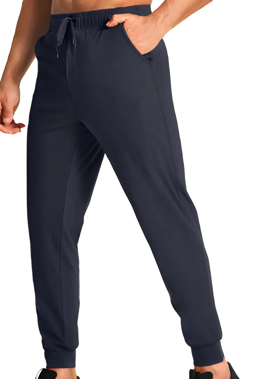 Man wearing solid colour loose-fit casual polyester trousers for leisure activities.