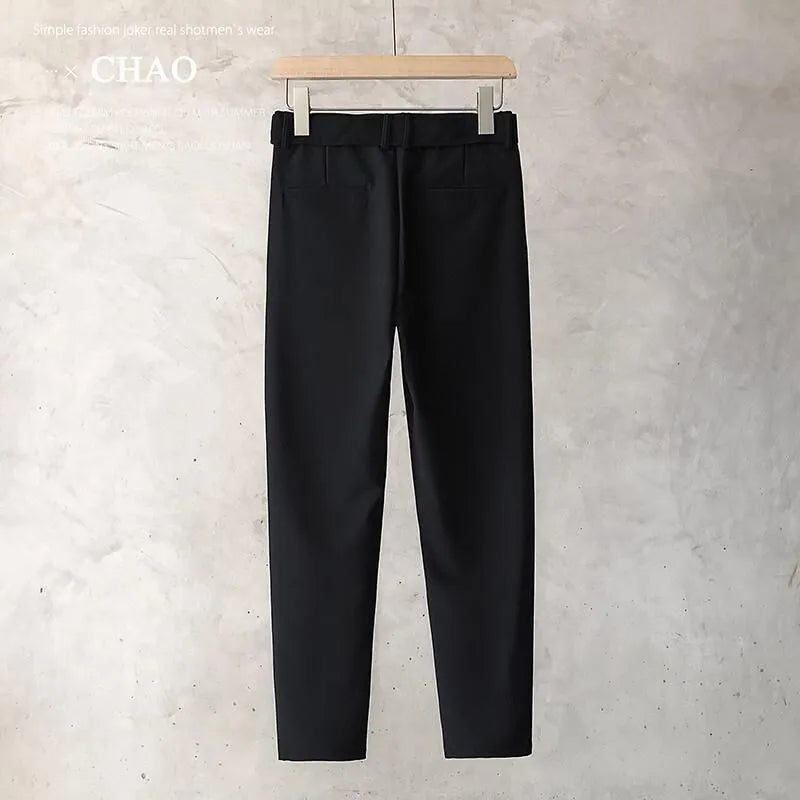 Boys slim straight trousers in wool blend fabric on a hanger, showing tapered leg