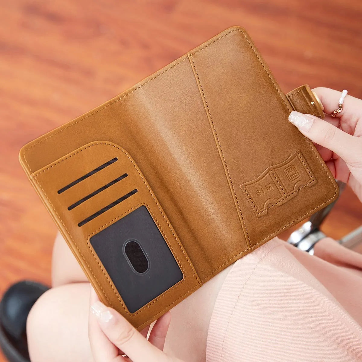 PU leather multifunctional passport holder wallet in various colours showing sewing line detail and anti-theft protection.