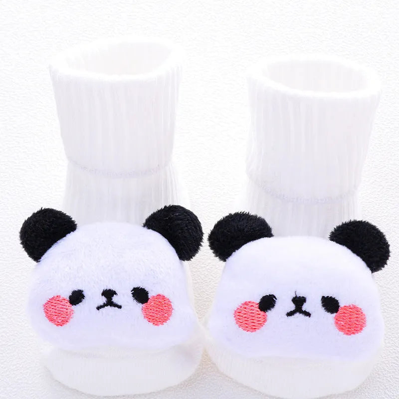 Cotton baby floor socks in a selection of colours and patterns like panda, lion, and bows, shown in sizes for infants.