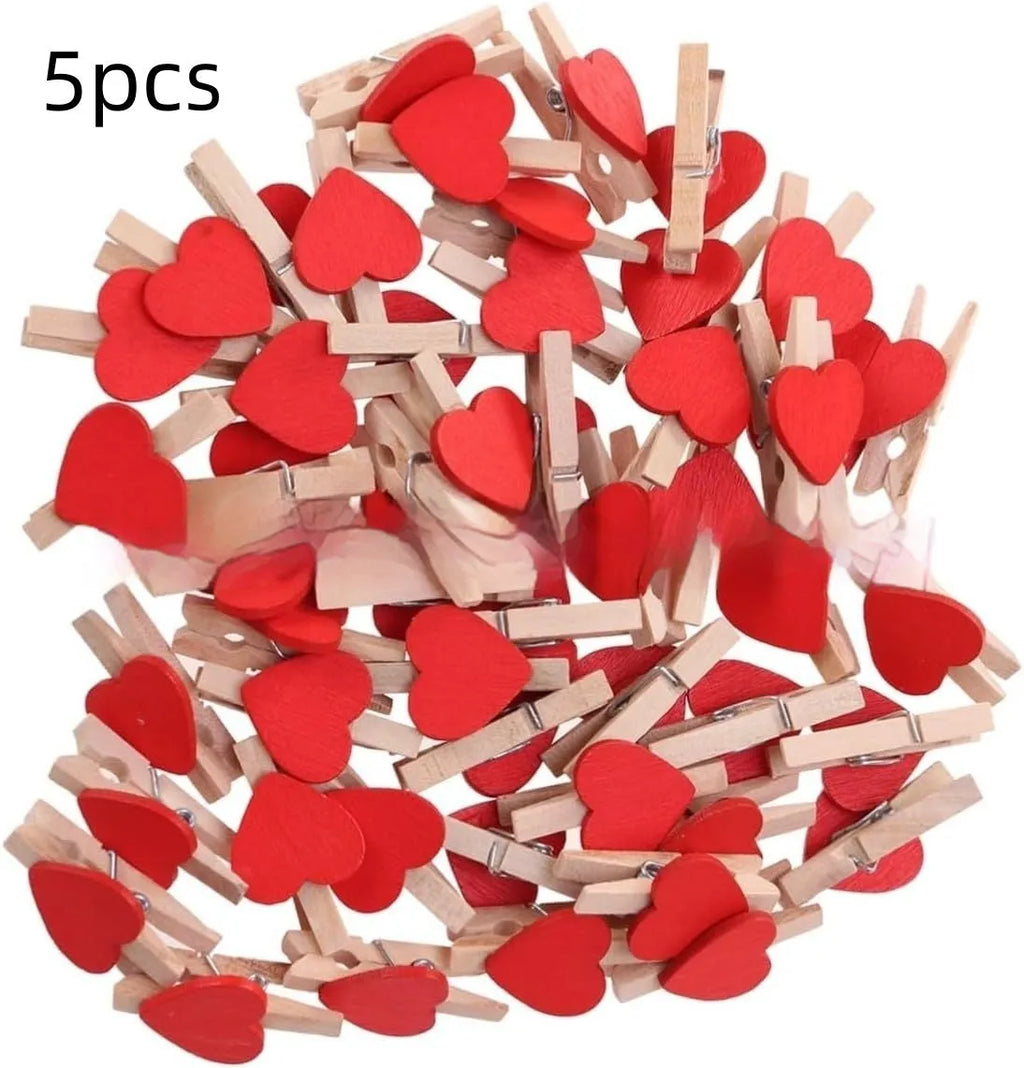 Five small handmade solid wood heart-shaped clips in red, rose red, and white colours.