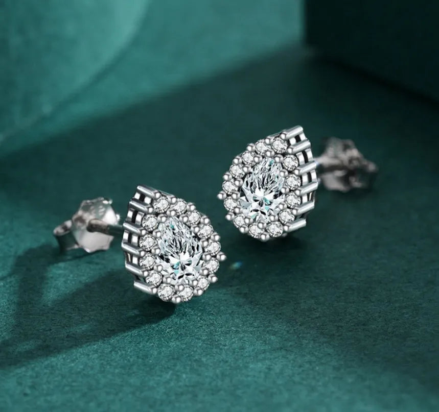 Women's silver water drop ear studs with 925 sterling silver construction and diamond treatment