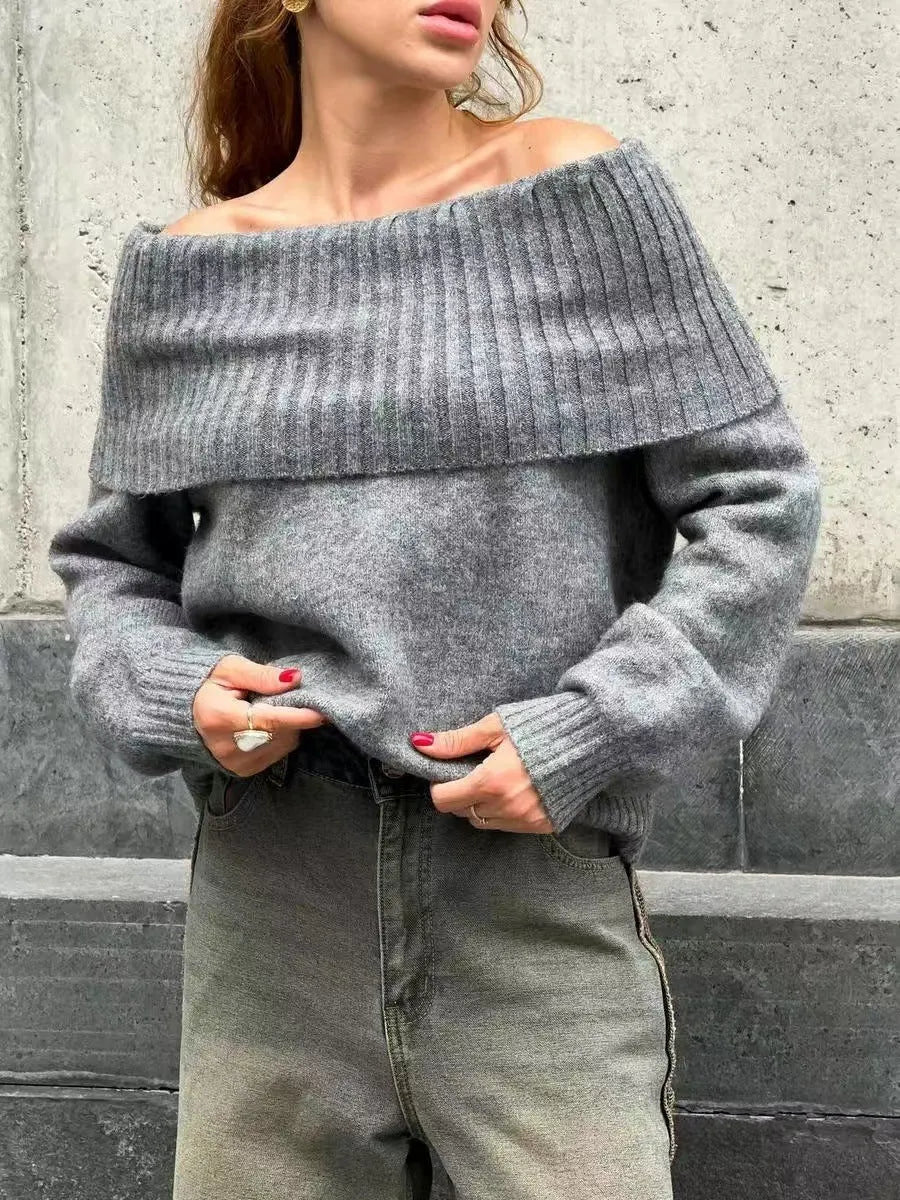 Grey off-the-shoulder strapless pullover sweater with a 3D pattern texture.
