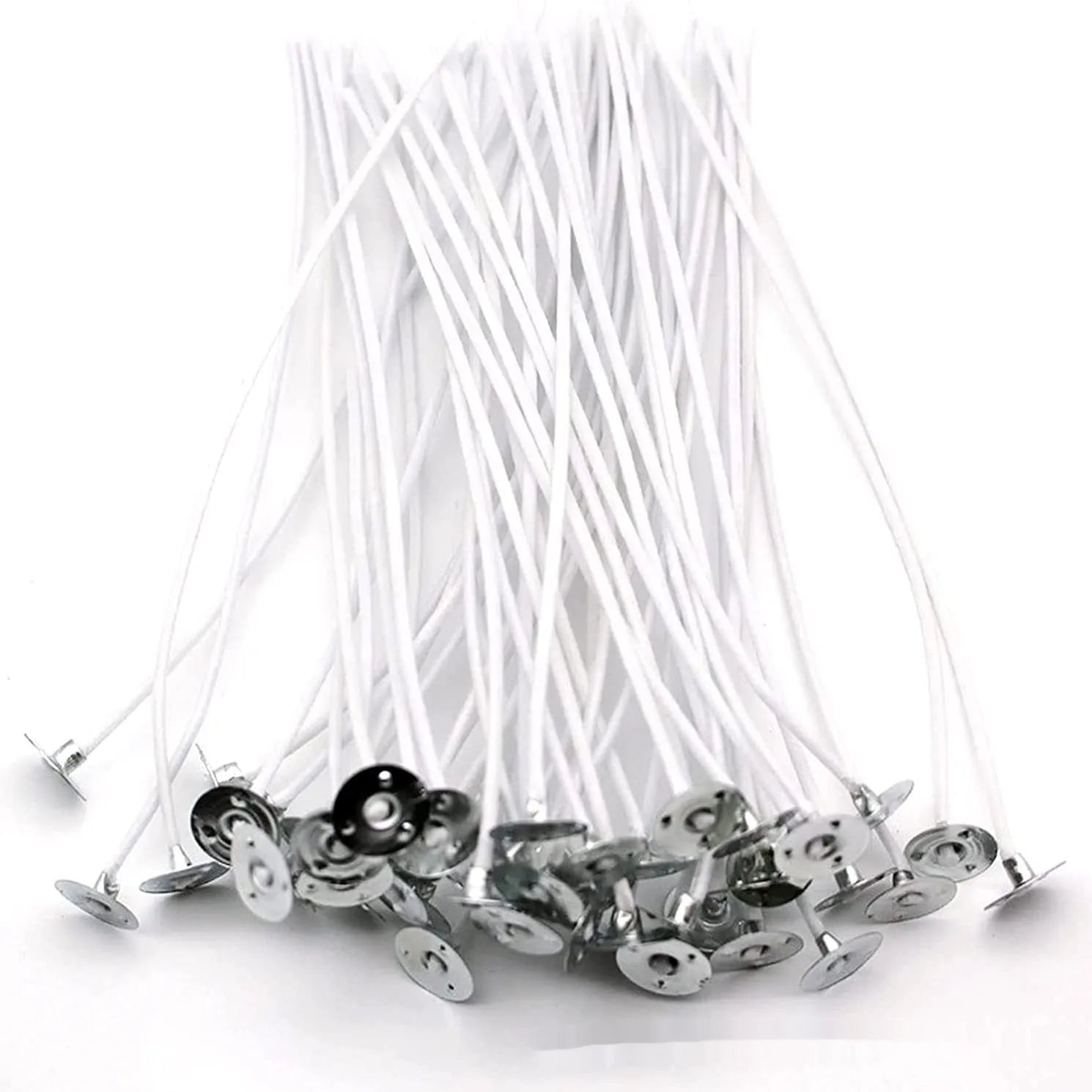 Close-up of white cotton candle wicks in three lengths: 2.6cm, 6cm, and 8cm.