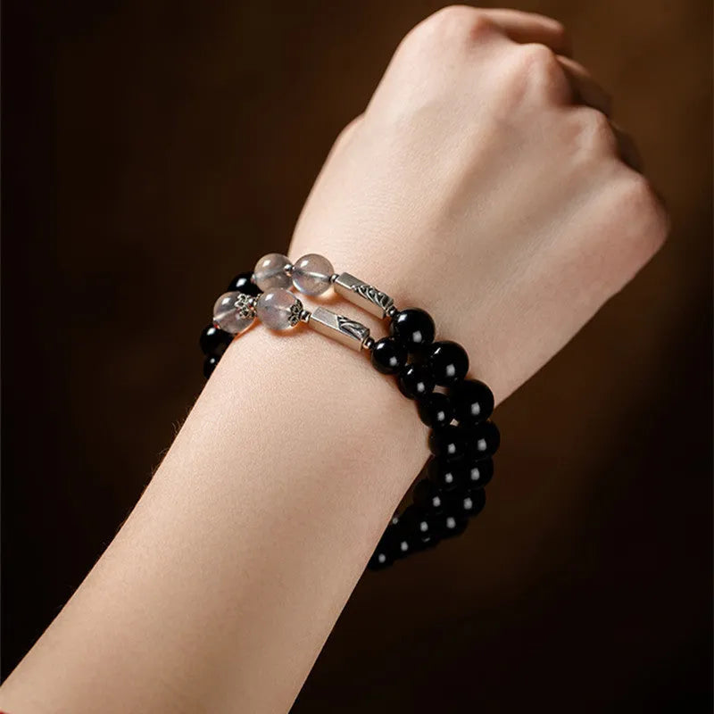 Obsidian Buddha beads couple bracelet set showing 8mm women's and 10mm men's sizing in national style