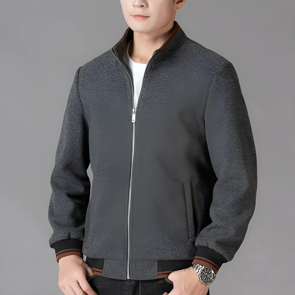 Men's grey sports-style wool fleece jacket with long sleeves and a stick pocket.