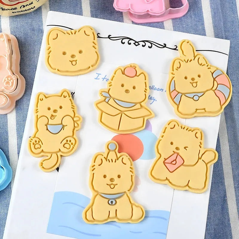 Three dimensional press plastic biscuit mould showing cartoon puppy designs
