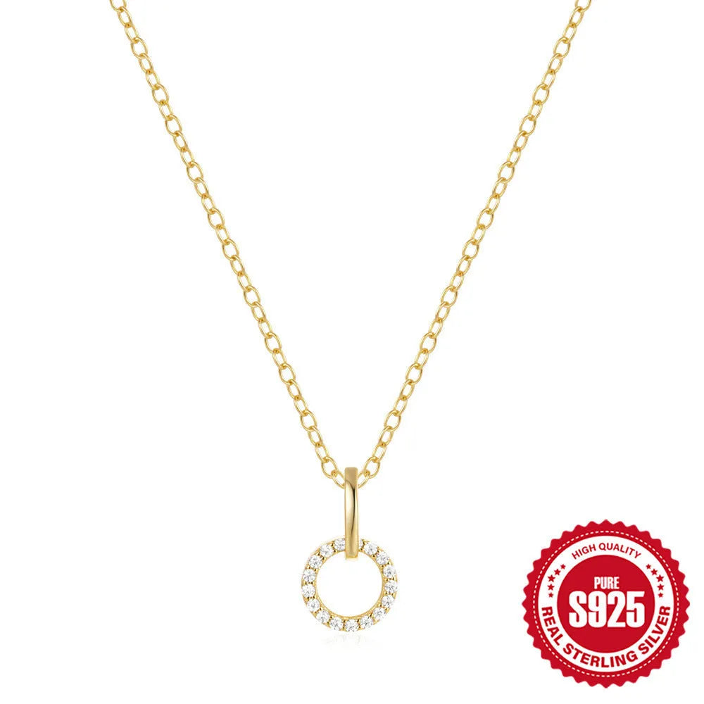 Gold-coloured sterling silver clavicle chain with interlocking geometric design and zircon stones