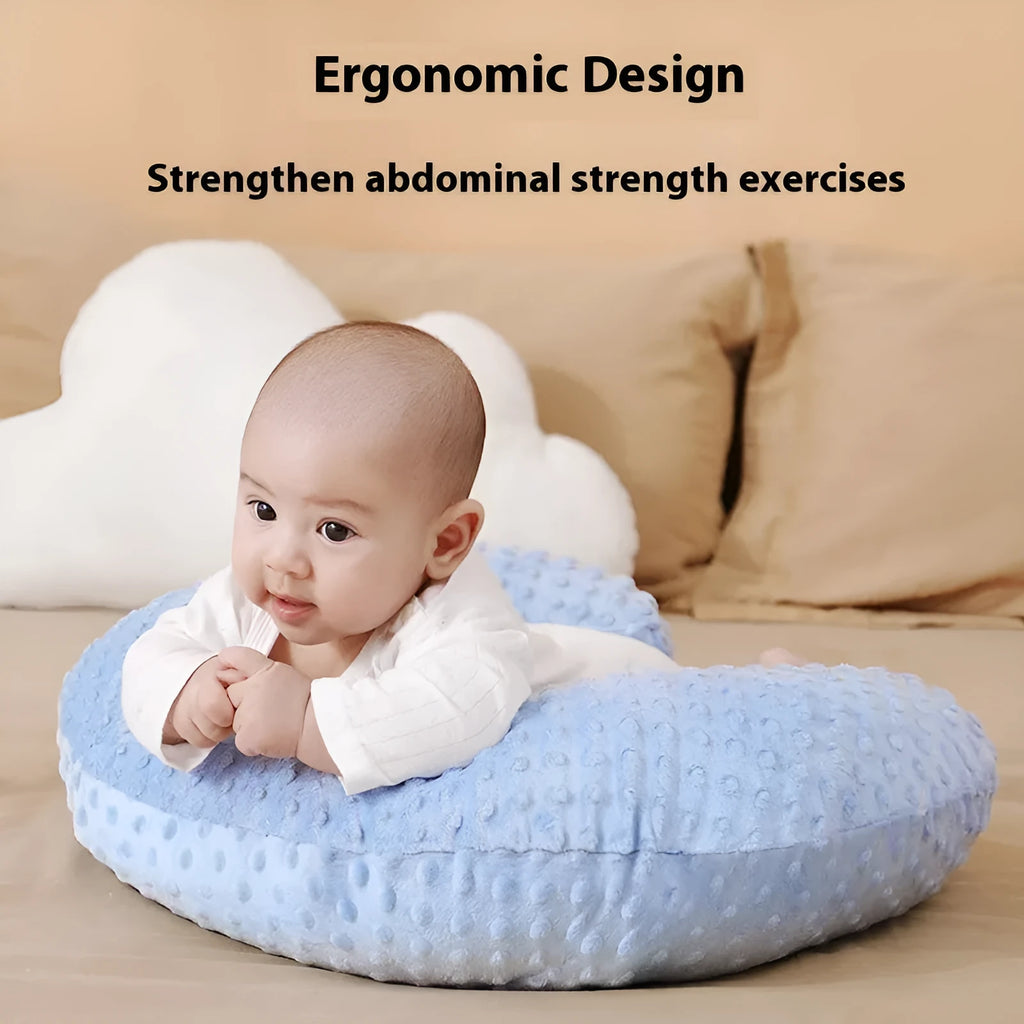 Pink nursing pillow with removable cover for breastfeeding and bottle feeding support.