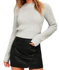 Long-sleeved slim fit knitted pullover sweater in acrylic fabric on a hanger