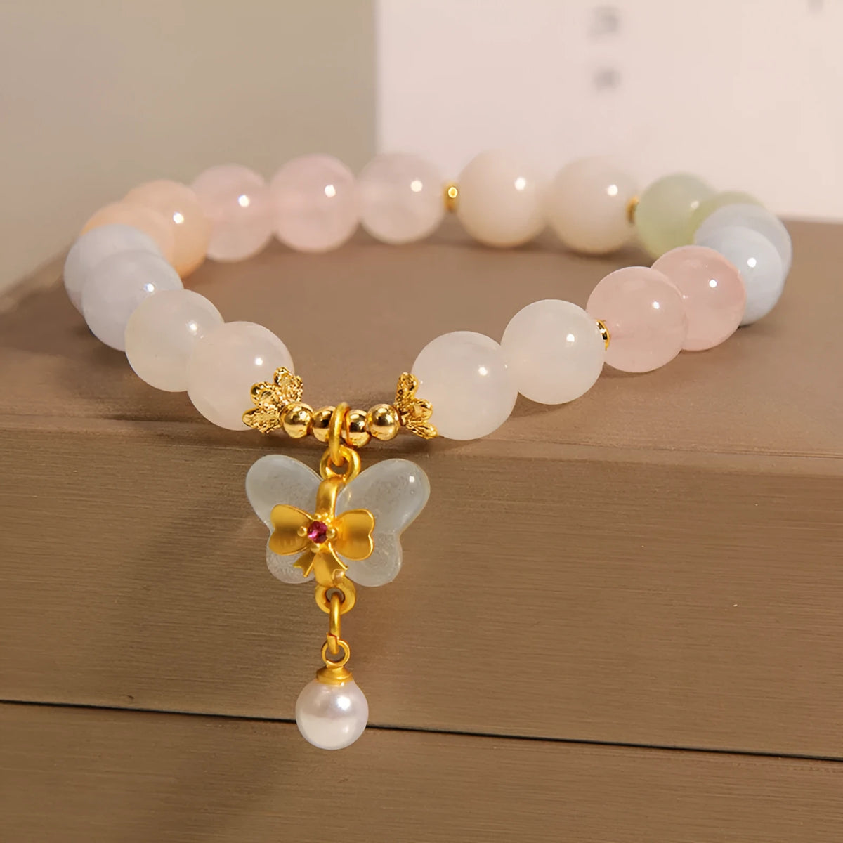 Women's crystal bracelet with colourful Morganite stone and butterfly pendant jewellery