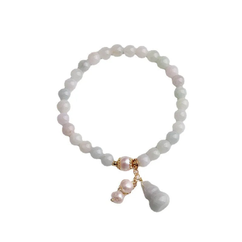 Women's jade bracelet with natural emerald jade insets and gourd design in Chinese style