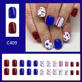 Short glossy red and blue strawberry cherry pattern false nail stickers laid out.