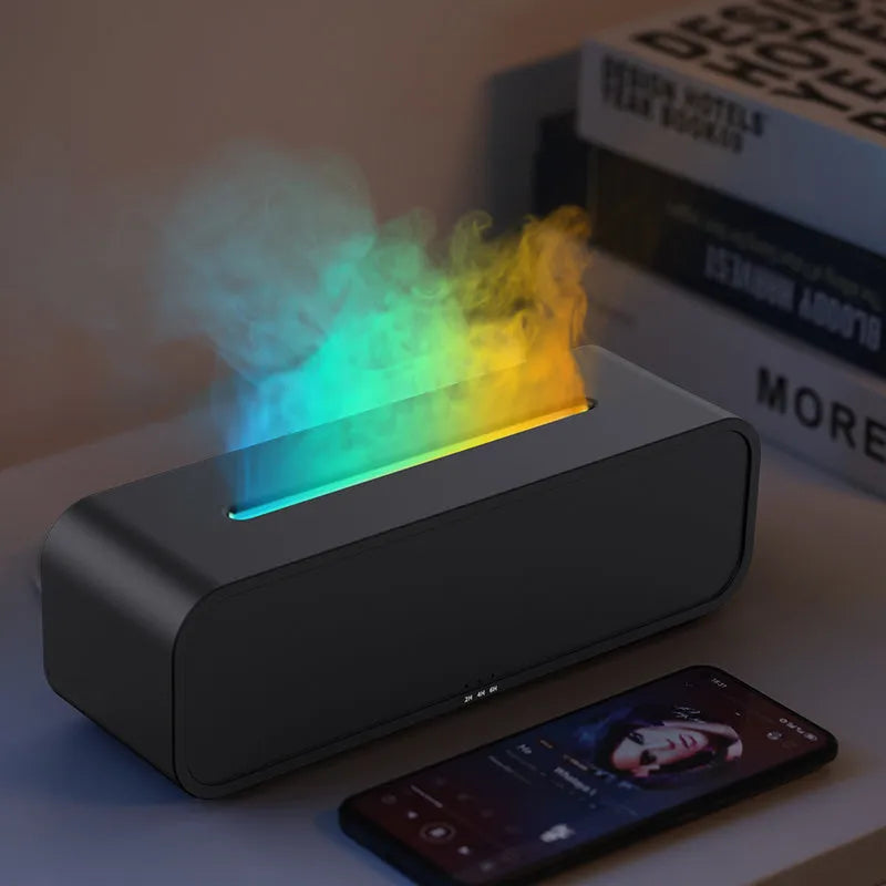 Black aromatherapy diffuser with colour-changing lights and remote control on table