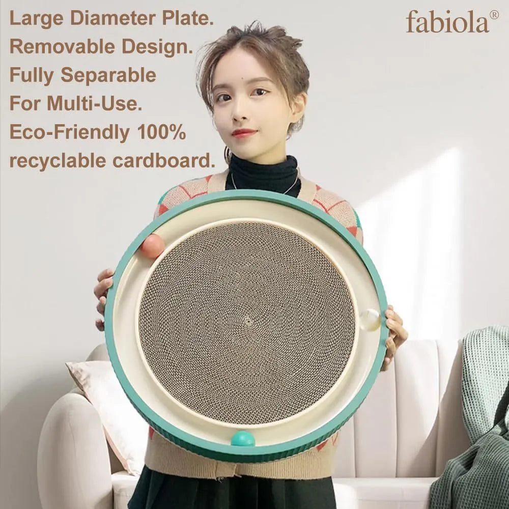 Large green circular cardboard cat scratching board with built-in track balls and a spring plush ball toy.
