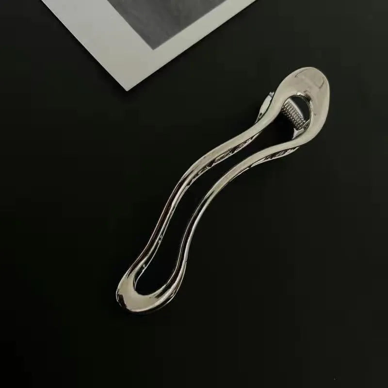 Golden and silver zinc alloy barrettes in square, arc and triangle designs for women's hair