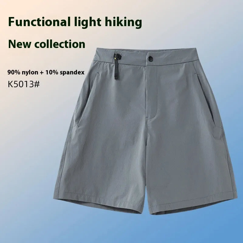 Man wearing khaki quick-drying sports shorts with an elastic waistband for running or climbing.
