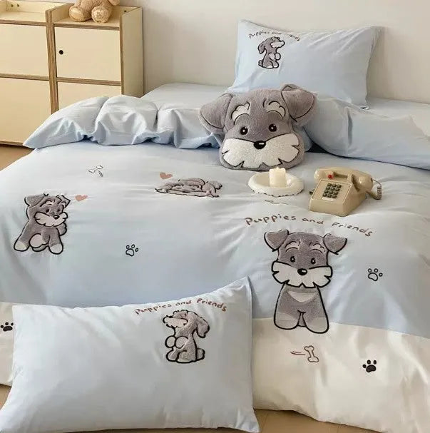 Cartoon Schnauzer design embroidered on a thickened cotton quilt cover and pillowcase from a complete bed linen set.