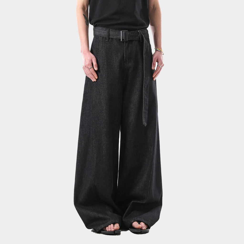 Black straight leg jeans with high waist and subtle gold metallic details, zip fly fastening