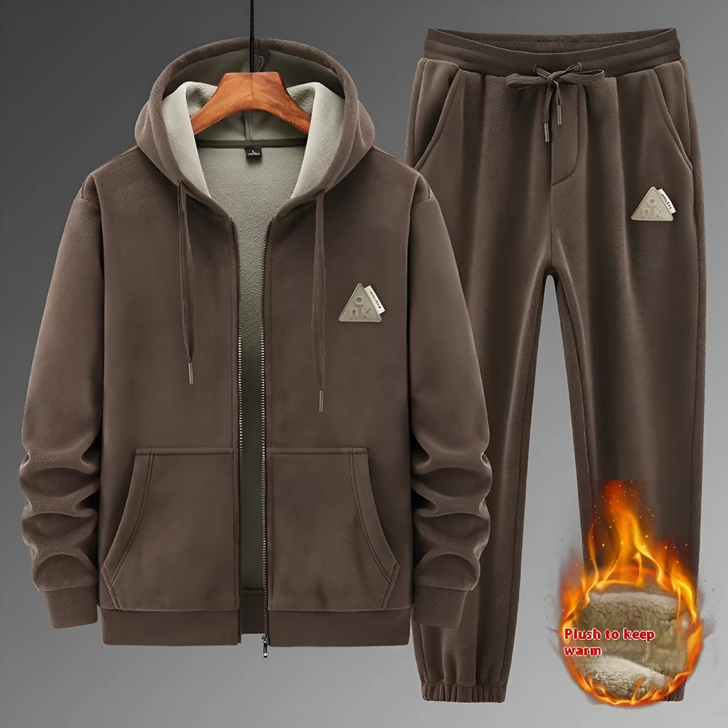 Casual sports suit consisting of a grey cashmere hooded sweater and matching cotton trousers.