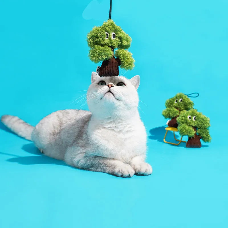 Pine tree-shaped cat chew toy with a dangling pendant, shown in three sizes.