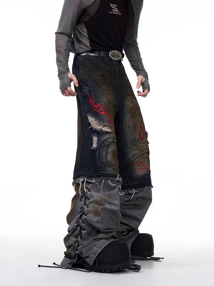 Men's light blue retro jeans with detachable trouser legs, showing wide-leg loose fit.