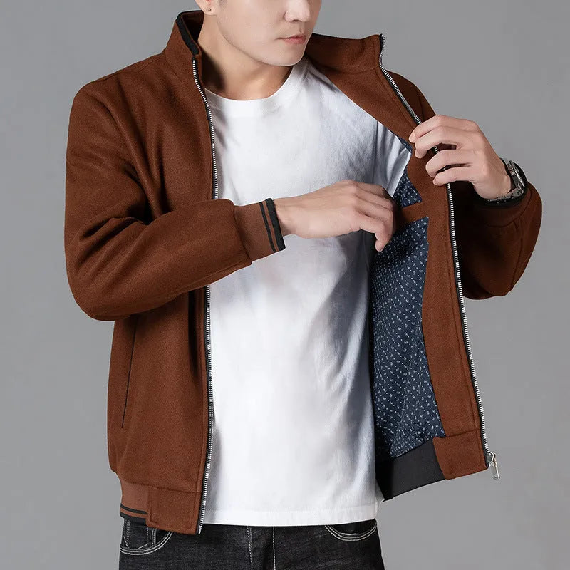 Men's grey sports-style wool fleece jacket with long sleeves and a stick pocket.