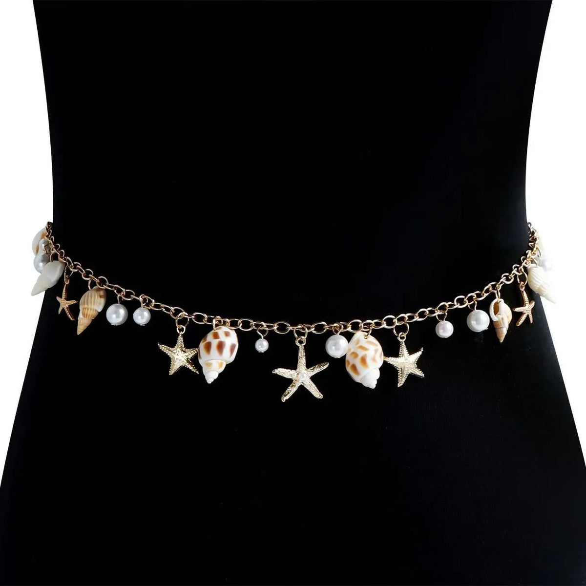 Women's alloy waist chain and matching bracelet with shell and star decorations.