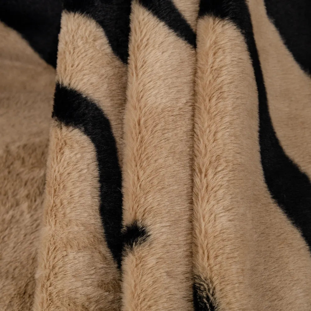 Zebra pattern flannel sofa cover and pillowcase set on a sofa, shown in caramel colour.