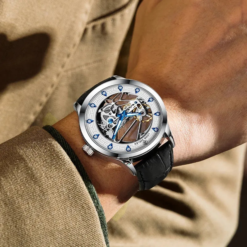 Men's silver mechanical watch with black leather strap, white dial, blue hands, and butterfly buckle