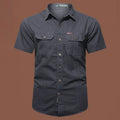 Men's short sleeve cotton work shirt in a loose cardigan style, shown in various colours including army green and blue.