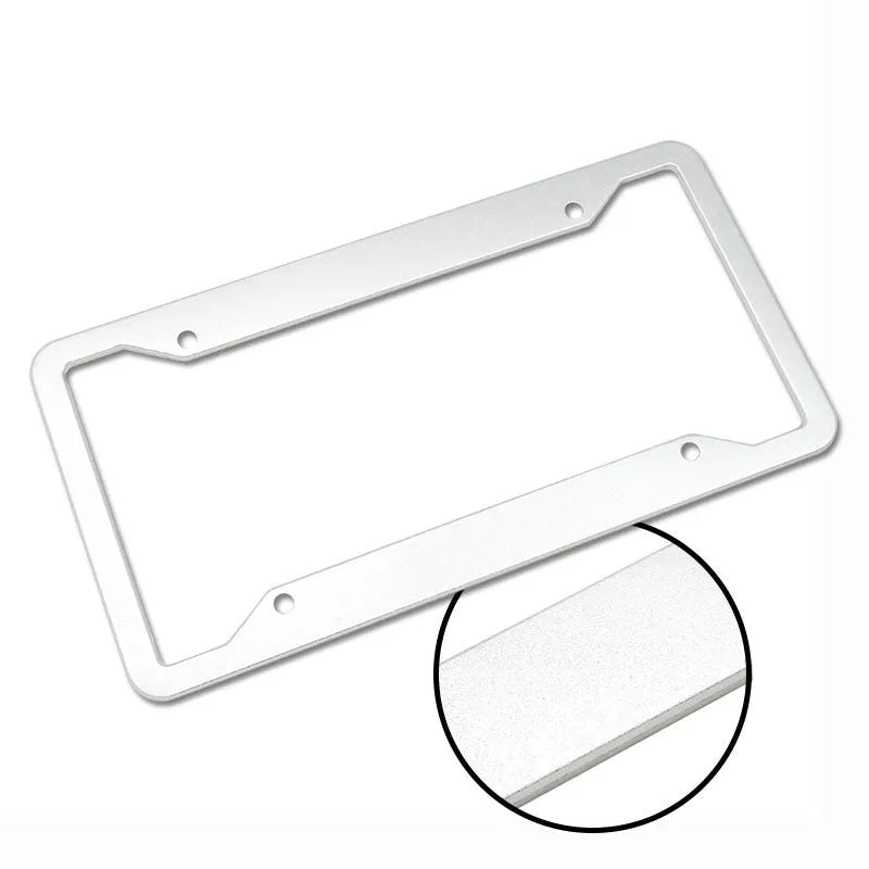 Aluminium alloy license plate frame in choice of four finishes next to a car registration plate.