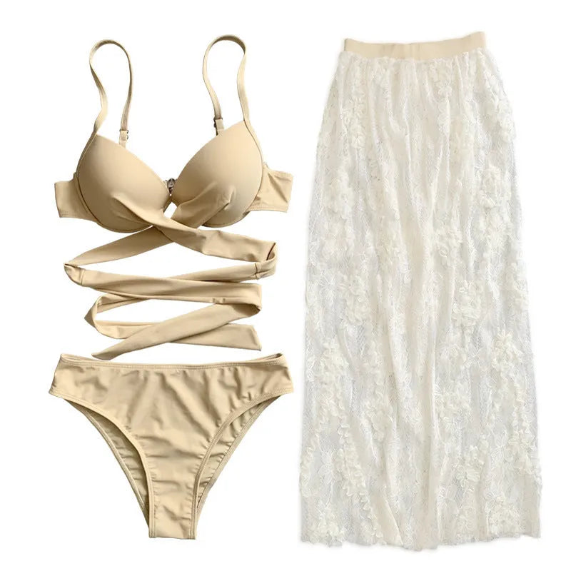 Three-piece backless push-up bikini set in polyester fabric with top, panties and skirt components