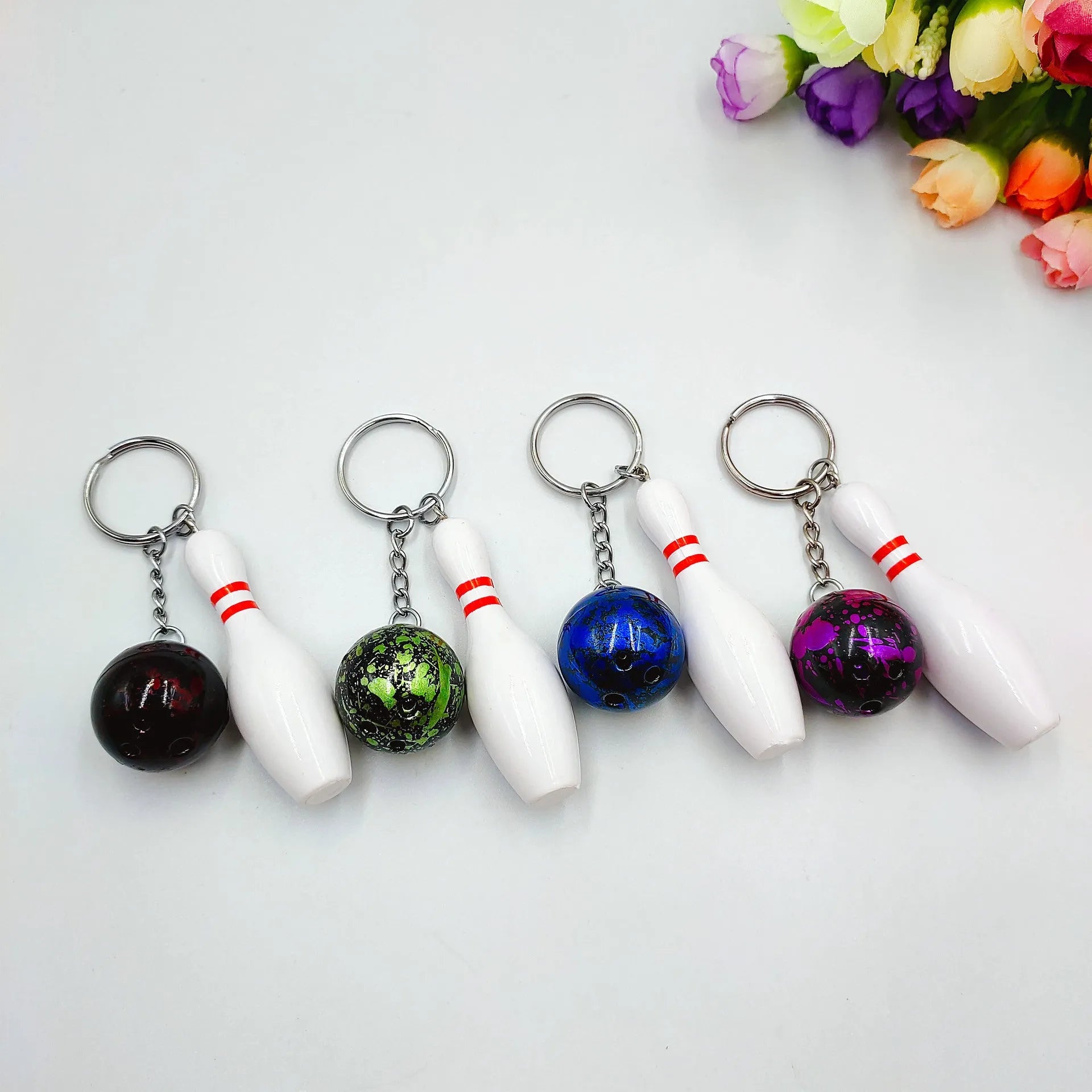 Mini bowling keychain pendant in four colour options on keyring