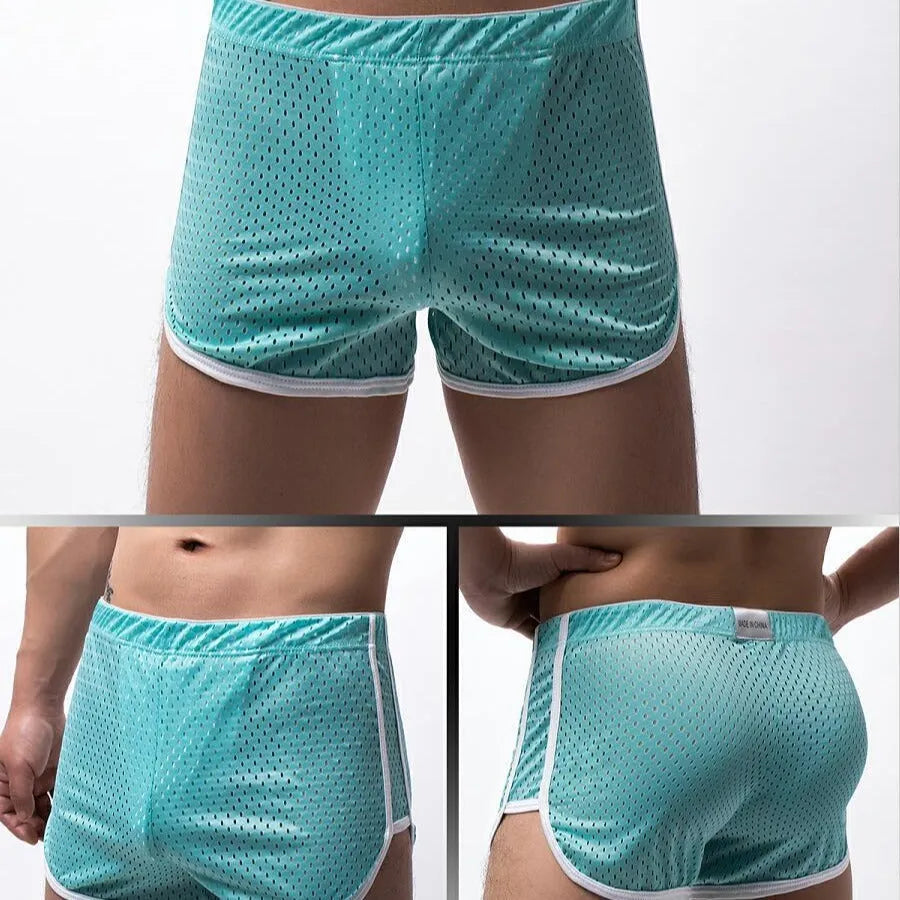 Men's three-point boxers in black, grey, blue, and white on a mid waist mannequin.